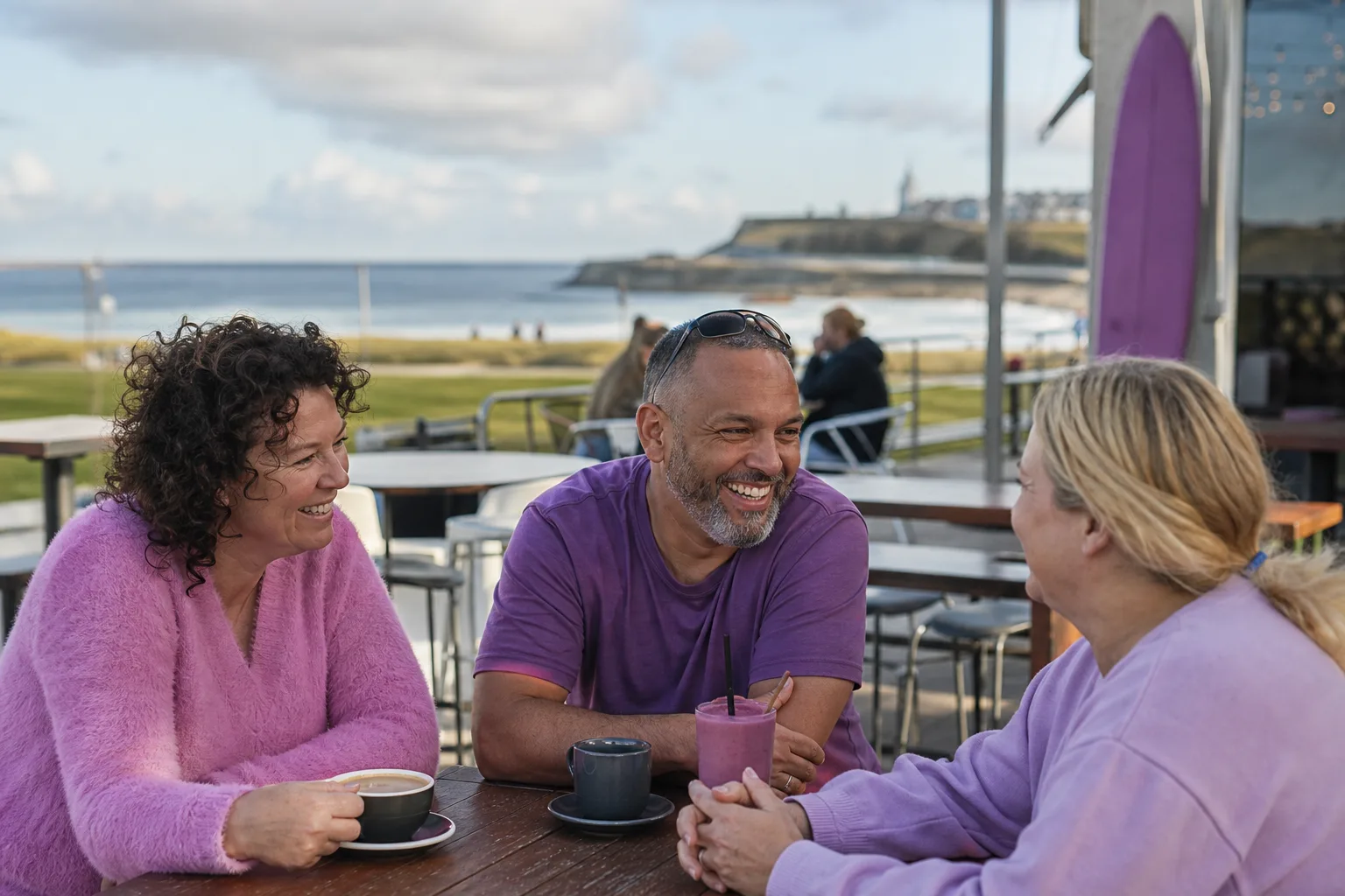 Two people talking beside Newcastle Harbour in New South Wales